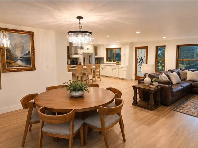 Shared dining area beside the living room at IMA House
